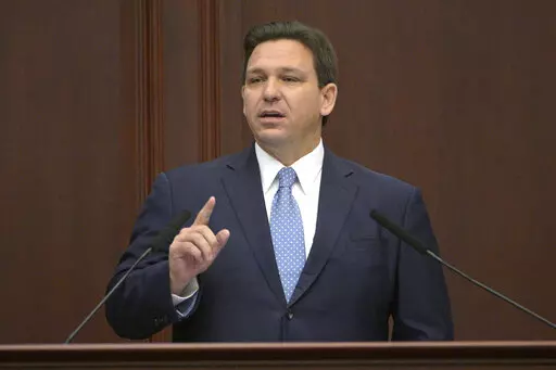 Florida Gov. Ron DeSantis addresses a joint session of a legislative session, Jan. 11, 2022, in Tallahassee, Fla. Florida Gov. DeSantis on Tuesday, April 19, asked the Legislature to repeal a law allowing Walt Disney World to operate a private government over its properties in the state, the latest salvo in a feud between the Republican and the media giant. (AP Photo/Phelan M. Ebenhack, File)