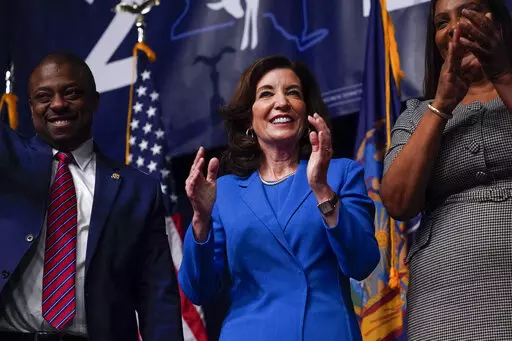 New York Gov. Kathy Hochul claps with supporters during the New York State Democratic Convention in New York, Thursday, Feb. 17, 2022.  Driven by moral outrage over Russia’s invasion of Ukraine, U.S. governors and other top state officials made it clear: They wanted to cut any financial ties with Russia (AP Photo/Seth Wenig, File)