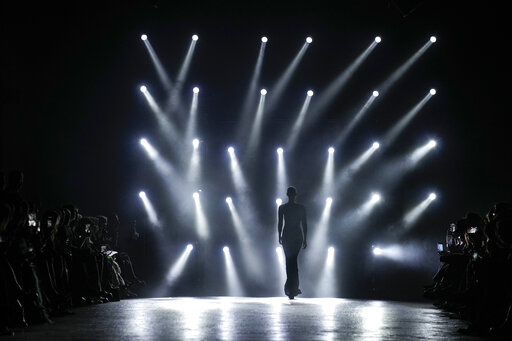 A model wears a creation as part of the Roberto Cavalli Fall/Winter 2022-2023 fashion collection, unveiled during the Fashion Week in Milan, Italy, Wednesday, Feb. 23, 2022. (AP Photo/Antonio Calanni)