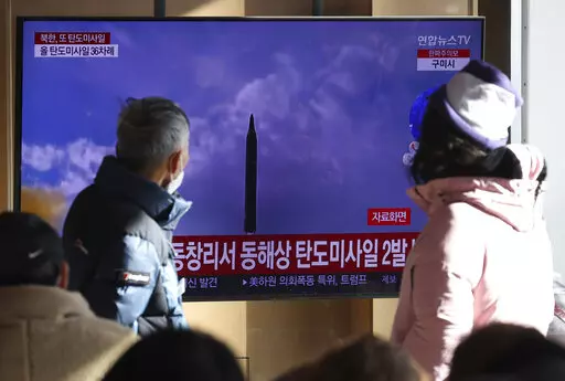 People watch a TV screen showing a news program about North Korea's missile launch with file footage, at the Seoul Railway Station in Seoul, South Korea, Sunday, Dec. 18, 2022. North Korea fired a pair of ballistic missiles on Sunday toward its eastern waters, its first weapons test in a month and coming two days after it claimed to have performed a key test needed to build a more mobile, powerful intercontinental ballistic missile designed to strike the U.S. mainland. (Shin Jun-hee/Yonhap via A