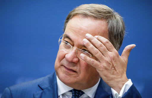 North Rhine-Westphalia's State Premier, chairman of the Christian Democratic Union party and candidate for Chancellery Armin Laschet addresses journalists after a party's leaders meeting in Berlin, Germany, Aug. 30, 2021. (Michael Kappeler/dpa via AP)