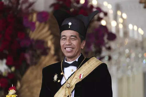 Indonesian President Joko Widodo, dressed in traditional Central Javanese royalty outfit, smiles during a ceremony marking the country's 78th anniversary of independence at Merdeka Palace in Jakarta, Indonesia, on Aug. 17, 2023. Widodo's phenomenal rise from a riverside slum, where he grew up, to the presidency of Indonesia spotlighted how far the world's third-largest democracy had veered from a brutal authoritarian era a decade ago. With his second and final five-year term ending in October, W
