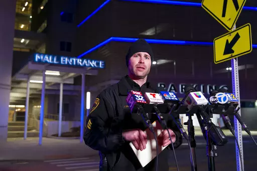 Rosemont Public Safety Department Sgt. Joe Balogh updates the media staged outside the Rosemont Outlet Mall where a fatal shooting occurred inside, Friday, March 25, 2022, in Rosemont, Ill. (Tyler Pasciak LaRiviere/Chicago Sun-Times via AP)