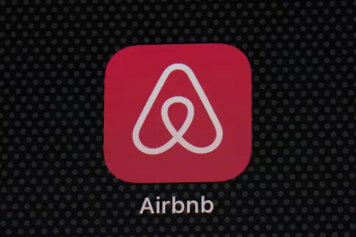 The Airbnb app icon is displayed on an iPad screen in Washington, D.C., on May 8, 2021. Airbnb says it's cracking down on fake listings, which are emerging as a major problem for customers of the short-term rental site. Airbnb said Wednesday Sept. 20 2023 it has removed 59,000 fake listings and blocked another 157,000 from joining the site this year. Fake listings and high cleaning fees are among several issues that customers are raising with Airbnb. (AP Photo/Patrick Semansky, File)