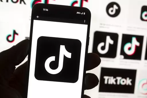 The TikTok logo is seen on a cell phone on Oct. 14, 2022, in Boston. The White House is giving all federal agencies 30 days to wipe TikTok off all government devices, as the Chinese-owned social media app comes under increasing scrutiny in Washington over security concerns. (AP Photo/Michael Dwyer, File)