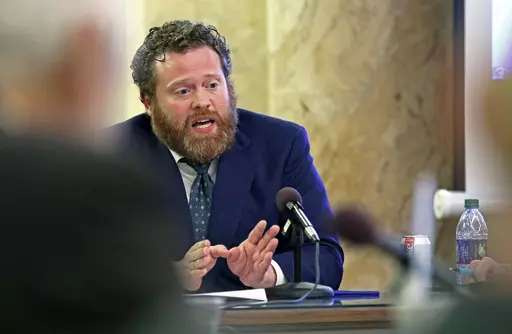 Drew Snyder, executive director of the Mississippi Division of Medicaid, gives an agency update to members of the House Medicaid Committee at the state Capitol, Jan. 23, 2019, in Jackson, Miss. The division announced, Monday, July 10, 2023, that it has started removing thousands of people from the program after the end of a pandemic public health emergency. (AP Photo/Rogelio V. Solis, File)