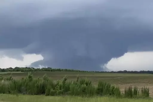 This screenshot taken from a video shows a tornado on June 14, 2023, in Blakely, Ga. Officials from Texas to Georgia are reporting damaging winds and possible tornadoes as a powerful storm system crosses the South. (Rand McDonald via AP)