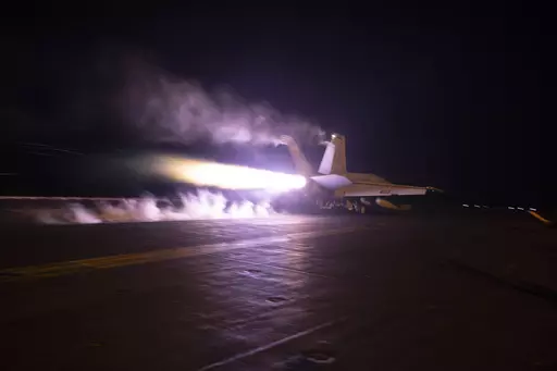 This image provided by the U.S. Navy shows an aircraft launching from USS Dwight D. Eisenhower (CVN 69) during flight operations in the Red Sea, Jan. 22, 2024. The United States and Britain struck 36 Houthi sites in Yemen on Saturday, Feb. 3, in a second wave of assaults meant to further disable Iran-backed groups in the region. (Kaitlin Watt/U.S. Navy via AP)