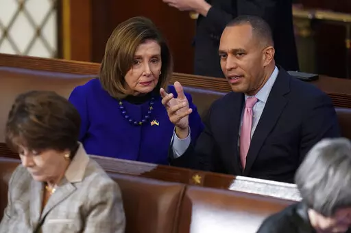 Rep. Hakeem Jeffries, D-N.Y., right, talks with Rep. Nancy Pelosi, D-Calif., during the eighth vote in the House chamber as the House meets for the third day to elect a speaker and convene the 118th Congress in Washington, on Jan. 5, 2023. Democrats are basking in having displayed remarkable unity, with every one of their members backing party leader Hakeem Jeffries for the House speakership again and again and again. Speculation Biden might have to overcome a hard Democratic primary has also qu