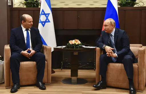 Russian President Vladimir Putin, right, and Israeli Prime Minister Naftali Bennett speak during their meeting in Sochi, Russia, Oct. 22, 2021. Just a year ago, Naftali Bennett was struggling for his political survival as Israel headed toward its fourth consecutive election. Today, the Israeli prime minister is at the forefront of global efforts to end the war in Ukraine. (Evgeny Biyatov, Sputnik, Kremlin Pool Photo via AP, File)