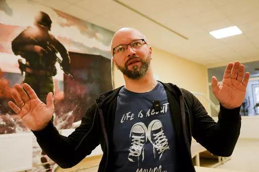 Witalij Miskow, 45, speaks about his mental trauma at a clinic which treats veterans for PTSD, post-combat stress and post-concussion trauma, in Kyiv, Ukraine, Monday, Nov. 21, 2022. When peace returns to Ukraine, many thousands of its combatants will likely return with psychological scars from the battlefields. A mental health rehabilitation center for soldiers on the outskirts of Ukraine's capital, Kyiv, treats post-traumatic disorders with acupuncture, soothing sounds and other therapies. (AP