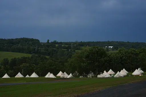 Tents are set up at Bethel Woods Center for the Arts, the site of Woodstock Music and Art Fair, Friday, June 14, 2024, in Bethel, N.Y. (AP Photo/Julia Nikhinson)