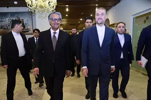 In this photo released by Pakistan's Ministry of Foreign Affairs, visiting Iran's Foreign Minister Hossein Amirabdollahian, front right, walks with his Pakistani counterpart Jalil Abbas Jilani, front left, upon his arrival for a meeting at the Ministry of Foreign Affairs in Islamabad, Pakistan, Monday, Jan. 29, 2024. Iran's foreign minister was in Pakistan for talks on deescalating tensions after deadly airstrikes by Tehran and Islamabad earlier this month killed at least 11 people, marking a si