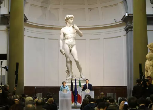 German Chancellor Angela Merkel, left, and Italian Prime Minister Matteo Renzi speak during a press conference in front of Michelangelo's "David statue" after their bilateral summit in Florence, Italy, Jan. 23, 2015. A Florida charter school principal has been forced to resign after a parent complained sixth graders were exposed to pornography during a lesson on Renaissance art that included Michelangelo’s “David” sculpture. (AP Photo/Antonio Calanni, File)