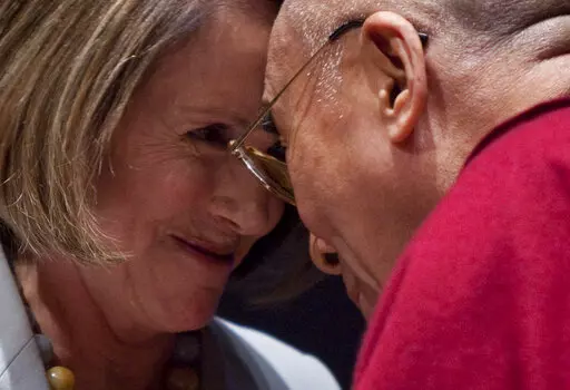 The Dalai Lama greets House Speaker Nancy Pelosi of Calif. on Capitol Hill in Washington, Oct. 6, 2009, during the inaugural Tom Lantos Human Rights Prize awards ceremony. (AP Photo/Evan Vucci, File)