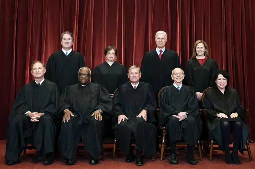 Members of the Supreme Court pose for a group photo at the Supreme Court in Washington, April 23, 2021. Seated from left are Associate Justice Samuel Alito, Associate Justice Clarence Thomas, Chief Justice John Roberts, Associate Justice Stephen Breyer and Associate Justice Sonia Sotomayor, Standing from left are Associate Justice Brett Kavanaugh, Associate Justice Elena Kagan, Associate Justice Neil Gorsuch and Associate Justice Amy Coney Barrett. The Supreme Court is refusing to say whether th
