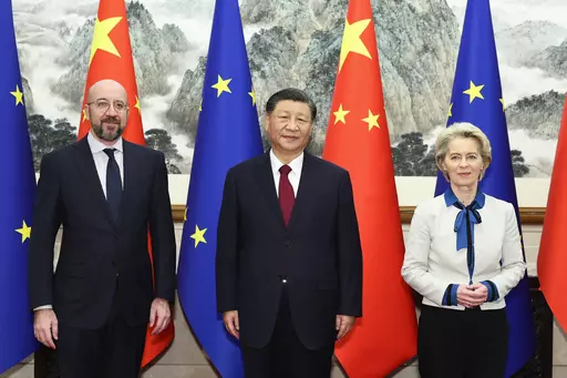 In this photo released by Xinhua News, Agency, Chinese President Xi Jinping, center, stands for a group photograph with European Commission President Ursula von der Leyen, right, and European Council President Charles Michel prior to their meeting at the Diaoyutai State Guesthouse in Beijing, Thursday, Dec. 7, 2023. The leaders of China and the European Union were holding wide-ranging talks Thursday that included their disputes over trade and a deep divide on the war in Ukraine. (Huang Jingwen/X