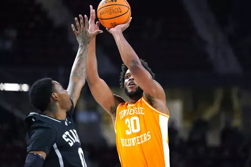 Tennessee guard Josiah-Jordan James (30) shoots over Mississippi State forward D.J. Jeffries (0) during the first half of an NCAA college basketball game in Starkville, Miss., Tuesday, Jan. 17, 2023. (AP Photo/Rogelio V. Solis)