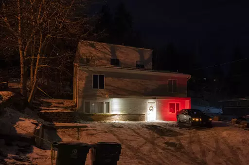 A private security officer sits in a vehicle, Tuesday, Jan. 3, 2023, in front of the house in Moscow, Idaho where four University of Idaho students were killed in November, 2022. Authorities said Wednesday, Jan. 4, that Bryan Kohberger, the man accused in the killings, has left a Pennsylvania jail in the custody of state police. The move means Kohberger could be headed to Idaho to face first-degree murder charges. (AP Photo/Ted S. Warren)