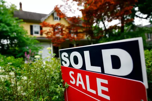 A sale sign stands outside a home in Wyndmoor, Pa., Wednesday, June 22, 2022. If you’re settling into a new home, you might be looking to fill it with furniture. But after your rent or mortgage, security deposit and moving expenses, there might not be much left over for your dream couch or dining room set.  AP Photo/Matt Rourke)(