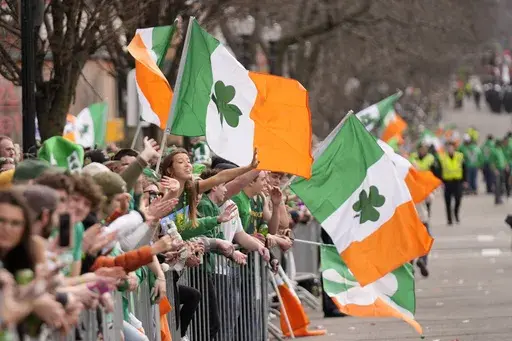 Spectators celebrate during the St. Patrick's Day parade, Sunday, March 16, 2025, in Boston, Mass. (AP Photo/Robert F. Bukaty)