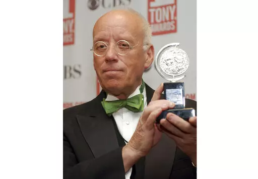 Eugene Lee poses with his Tony Award for Best Scenic Design for "Wicked" at the Tony Awards in New York on June 6, 2004. Lee, the six-time Emmy Award-winning production designer for “Saturday Night Live” and who won three Tony Awards for his Broadway sets, died Tuesday in Providence, R.I. He was 83. (AP Photo/Richard Drew, File)
