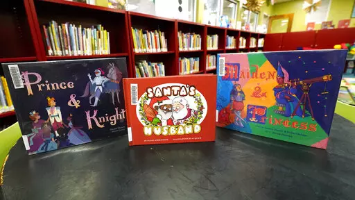 FILE -A public library in Ridgeland, Miss., is on track to receive full funding as of April 2022 after the city and the Madison County Library System resolved a dispute. In January 2022, Ridgeland Mayor Gene McGee said he planned to withhold $110,000 of public money from the library after he received complaints about the library displaying books “inappropriate for children,” including some LGBTQ-themed books similar to these that were photographed Thursday, Jan. 27, 2022. (AP Photo/Rogelio V