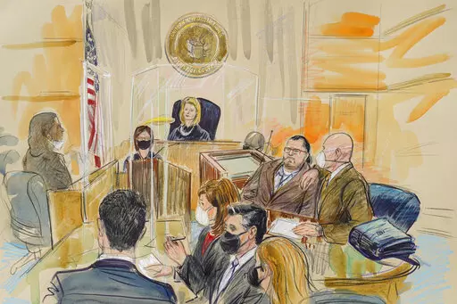 This artist sketch depicts Judge Dabney Friedrich looking out from the bench during jury selection for Guy Wesley Reffitt, joined by his lawyer William Welch, top right, in Federal Court, in Washington, Monday, Feb. 28, 2022. Seated from front left are members of the U.S. prosecution legal team, Tim Ryan, Risa Berkower, Jeff Nestler, and Amanda Rohde. Reffitt, a Texas man charged with storming the U.S. Capitol with a holstered handgun on his waist, is the first Jan. 6 defendant to go on trial. (