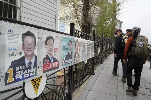 People pass by posters of candidates running for the upcoming parliamentary election in Seoul, South Korea, Wednesday, April 3, 2024. As South Koreans prepare to vote for a new 300-member parliament next week, many are choosing their livelihoods and other domestic topics as their most important election issues. This represents a stark contrast from past elections, which were overshadowed by security and foreign policy issues like North Korean nuclear threats and the U.S. security commitment.(AP 