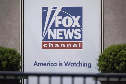 The Fox News logo is displayed outside Fox News Headquarters in New York, April 12, 2023. Former President Donald Trump's decision to back out of Fox News' first GOP primary debate this week likely costs the network a chance at a very large audience for the end of summer. It also tests the network's ability to pivot yet again after what has been a tough year, paying $787 million to settle a defamation lawsuit just as a trial was to begin, and firing popular personality Tucker Carlson shortly aft