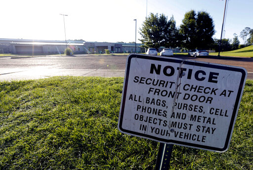 A security notice is posted outside the Hinds County Detention Center in Raymond, Miss., on June 12, 2015. A federal judge has issued a civil contempt order over conditions at the detention center.  U.S. District Judge Carlton Reeves wrote Friday, Feb. 4, 2022, that Hinds County officials have failed to fix problems in the jail that has experienced violence and lax security.  (AP Photo/Rogelio V. Solis, File)