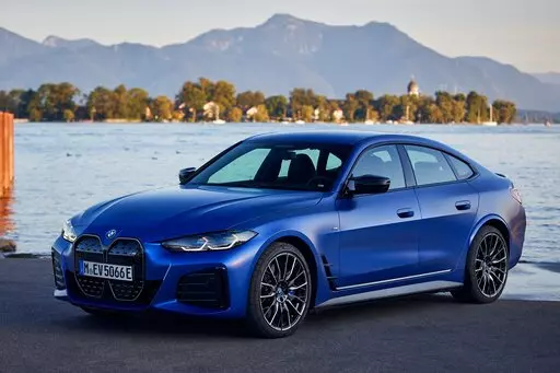 This photo provided by BMW shows the 2022 BMW i4, a new all-electric sedan with a rear cargo hatch and an estimated range of up to 301 miles. (Fabian Kirchbauer/BMW of North America via AP)