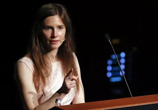 Amanda Knox speaks at a Criminal Justice Festival at the University of Modena, Italy, Saturday, June 15, 2019. Knox faces yet another trial for slander in a case that could remove the last remaining guilty verdict against her eight years after Italy's highest court definitively threw out her conviction for the murder of her 21-year-old British roommate, Meredith Kercher. (AP Photo/Antonio Calanni)
