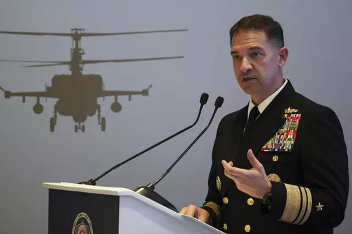 U.S. Navy Vice Adm. Brad Cooper, who heads the Navy's Bahrain-based 5th Fleet, speaks at an event at the International Defense Exhibition and Conference in Abu Dhabi, United Arab Emirates, Feb. 21, 2023. Iran is "very directly involved" in attacks by Yemen's Houthi rebels on shipping over Israel's war on Hamas in the Gaza Strip, Cooper told The Associated Press on Monday, Jan. 22, 2024. (AP Photo/Jon Gambrell, File)