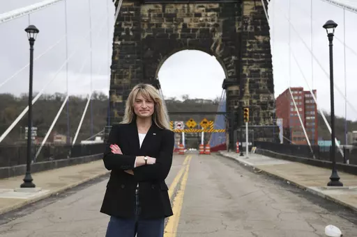 Transgender Mayoral candidate Rosemary Ketchum stands on a closed down bridge in Wheeling Island on Friday, April 5, 2024, in Wheeling, W.Va. (AP Photo/Kathleen Batten)