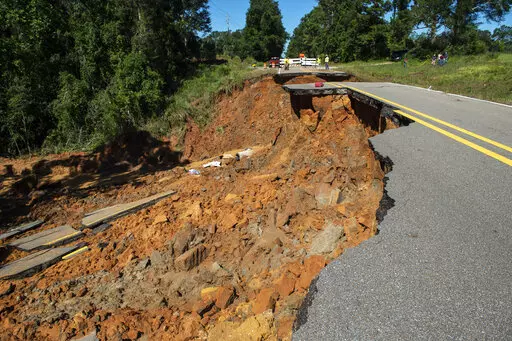 Part of Highway 26 washed away late Monday night, due to heavy rains from Hurricane Ida in the Benndale community in George County, Tuesday, Aug. 31, 2021. (Hannah Ruhoff/The Sun Herald via AP)