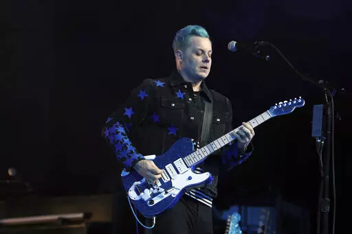 Jack White performs at the Masonic Temple Friday, April 8, 2022, in Detroit. White surprised fans by marrying musician Olivia Jean on stage during his Detroit homecoming show Friday. (Kirthmon F. Dozier /Detroit Free Press via AP)