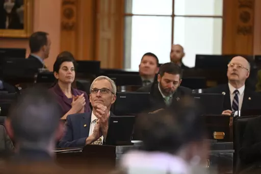 This image provided by the Ohio House Republican Caucus shows Rep. Dave Dobos, a Columbus-area Republican, sitting in the House chamber at the Ohio Statehouse in Columbus, Ohio on March 1, 2023. Dobos is under fire for falsely claiming for decades that he graduated from the Massachusetts Institute of Technology and has since stepped down from a House committee leadership post following the revelation. (Ohio House Republican Caucus via AP)