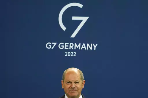 German Chancellor Olaf Scholz attends the presentation of a special stamp of the German mail service Deutsche Post for the upcoming G7 summit, at the chancellery in Berlin, Germany, Wednesday, June 15, 2022. Three back-to-back summits over the next week will test Western resolve to support Ukraine and the extent of international unity as rising geopolitical tensions and economic pain cast an increasingly long shadow. (AP Photo/Markus Schreiber, File)
