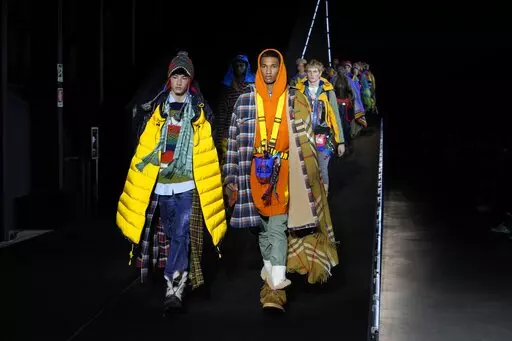 Models wear creations for the DSquared2 fall winter 22/23 collection, in Milan, Italy, Friday, Jan. 14, 2022. (AP Photo/Luca Bruno)