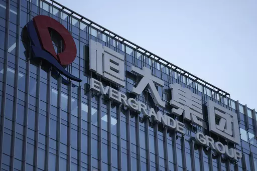 The Evergrande Group headquarters logo is seen in Shenzhen in southern China's Guangdong province on Sept. 24, 2021. Shares of debt-laden property developer China Evergrande Group soared Tuesday, Oct. 3, 2023, after they resumed trading in Hong Kong following a suspension last week. (AP Photo/Ng Han Guan, File)