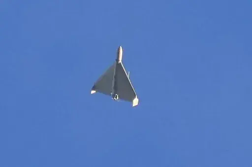 A drone is seen in the sky seconds before it fired on buildings in Kyiv, Ukraine, on Oct. 17, 2022. The Iranian-made drones that Russia sent slamming into central Kyiv this week have produced hand-wringing and consternation in Israel, complicating the country’s balancing act between Russia and the West. (AP Photo/Efrem Lukatsky)
