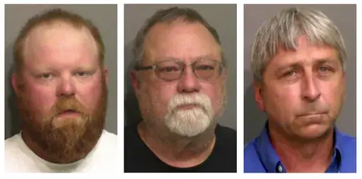 This combo of booking photos provided by the Glynn County, Ga., Detention Center, shows from left, Travis McMichael, his father Gregory McMichael, and William "Roddie" Bryan Jr.  Legal experts say federal hate crimes charges in the 2020 chase and killing of Ahmaud Arbery could prove more difficult to prosecute than the fall murder trial that ended in convictions of three white men. Jury selection is scheduled to begin Monday, Feb. 7, 2022 in U.S. District Court in Brunswick, Georgia.(Glynn Count