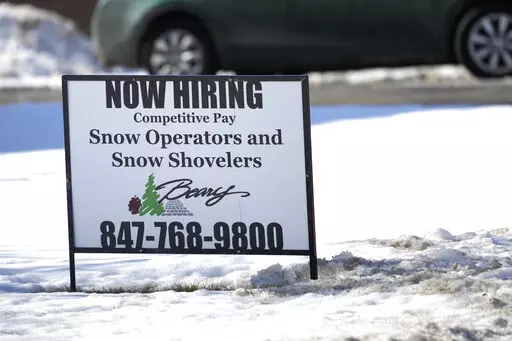 A hiring sign is displayed in Arlington Heights, Ill., Sunday, Feb. 5, 2022. On Thursday, the Labor Department reports on the number of people who applied for unemployment benefits last week. (AP Photo/Nam Y. Huh)