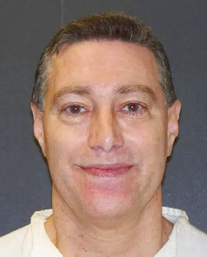 This booking photo provided by the Texas Department of Criminal Justice shows Robert Fratta, a former suburban Houston police officer on death row. Fratta was set to be executed on Tuesday, Jan. 10, 2023, for hiring two people to kill his estranged wife nearly 30 years ago. (Texas Department of Criminal Justice via AP, File)