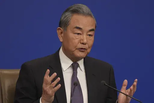 Chinese Foreign Minister Wang Yi speaks during a press conference on the sideline of the National People's Congress in Beijing, Friday, March 7, 2025. (AP Photo/Ng Han Guan)
