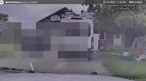 This still image from Sagadahoc County Sheriff’s Office shows dash camera video from Sept. 16, 2023 as police approach Robert Card's father's house. Police feared confronting the Army reservist prior to the worst mass shooting in state history would “throw a stick of dynamite on a pool of gas,” according to footage released by law enforcement. The videos were released to the Portland Press Herald and then sent to The Associated Press on Friday, Dec. 22. (Sagadahog County Sheriff's office/P