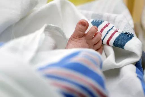 The toes of a baby are seen DHR Health, July 29, 2020, in McAllen, Texas. Dutton and Wrenlee are on the rise but they’re no match for champs Liam and Olivia as the top baby names in the U.S. last year. (AP Photo/Eric Gay, File)