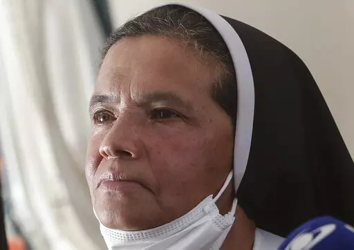 FILE — Colombian nun Gloria Cecilia Narvaez, who was held captive for nearly five years by al-Qaida-linked militants, listens to a question during a press conference in Bogota, Colombia, in this Friday, Nov. 19, 2021 file photo. Pope Francis authorized spending up to 1 million euro to free Narvaez, Cardinal Angelo Becciu testified at the Vatican's big financial fraud trial Thursday, May 5, 2022, revealing previously top secret negotiations that Francis authorized to hire a British security and