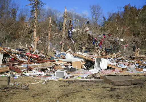 Cleanup efforts are underway in Winterset, Iowa, on Sunday, March 6, 2022, after a tornado tore through an area southwest of town on Saturday. (Bryon Houlgrave/The Des Moines Register via AP)